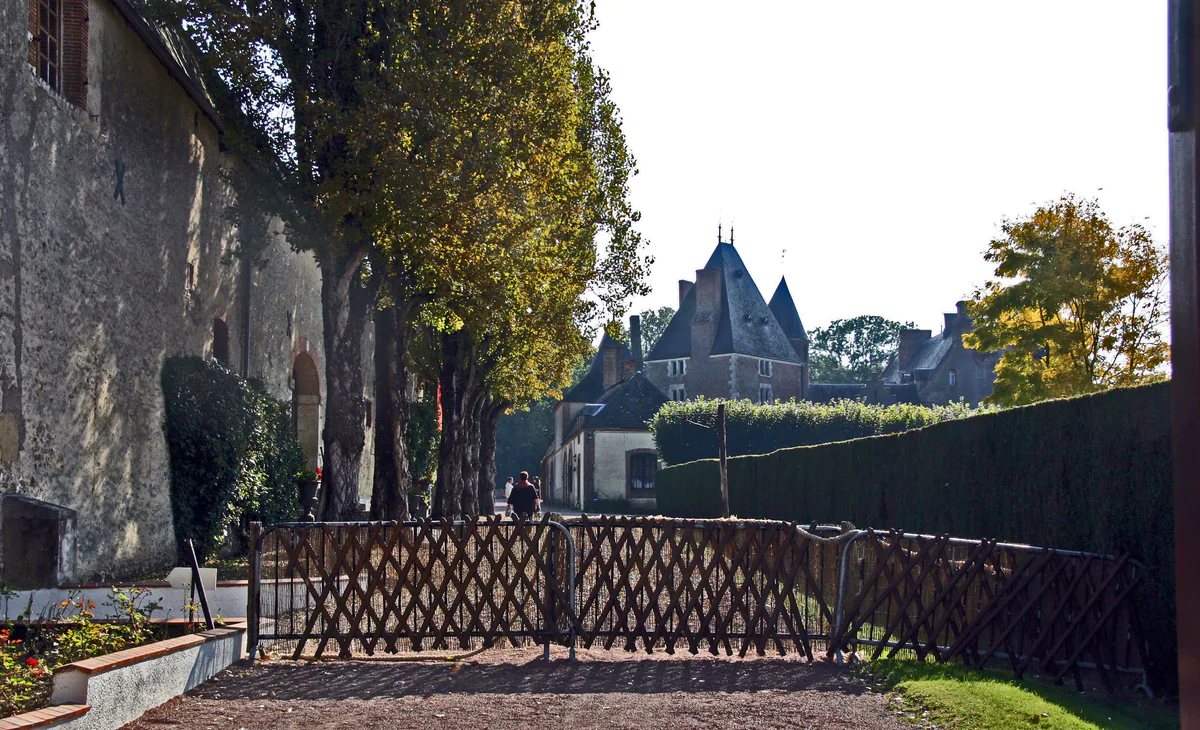 Château de Blancafort and its tall roofs viewed from the grounds